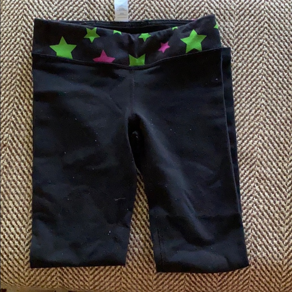 Size 6 black Ivivva pants with stars